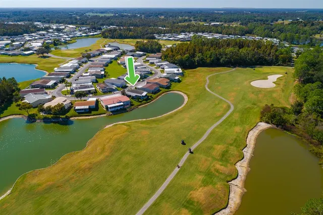 an aerial view of a house with a swimming pool