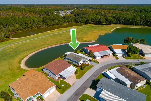 an aerial view of a city with lake view