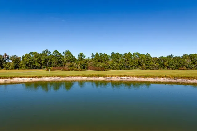 a view of a swimming pool with an outdoor space and seating area