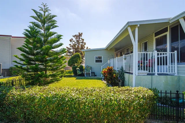 a view of a house with a backyard
