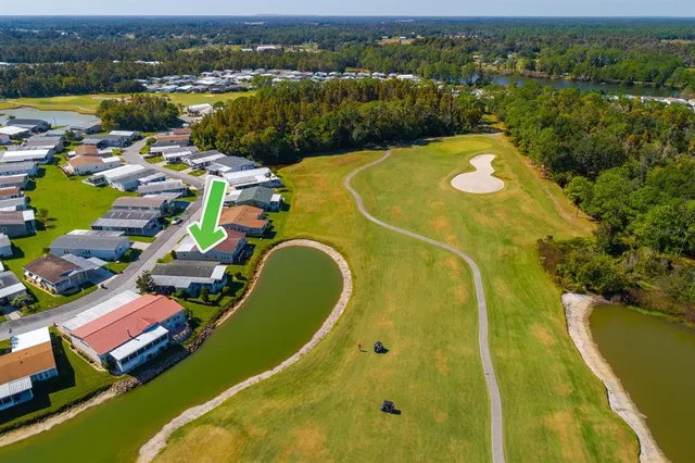 an aerial view of a house with a swimming pool