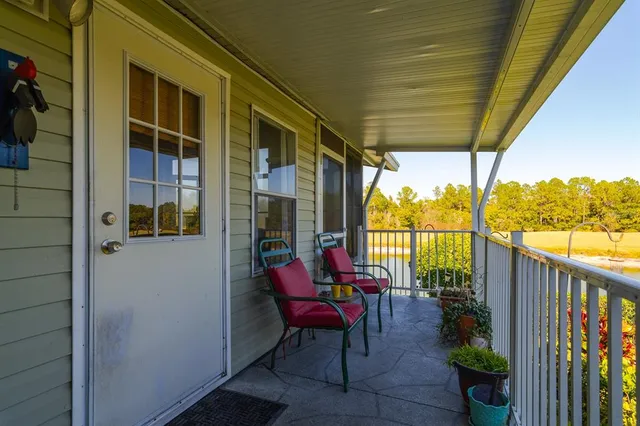 a view of a porch with furniture