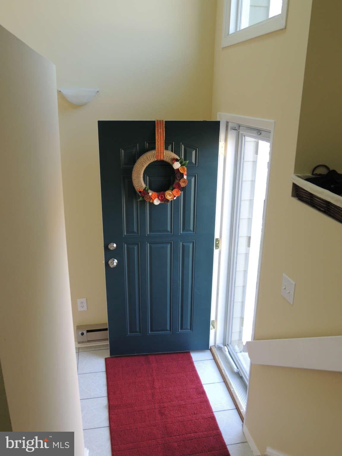 11033 Villaridge Court, Unit B Reston, VA 20191 - Photo 2 of 25 a view of a hallway with front door
