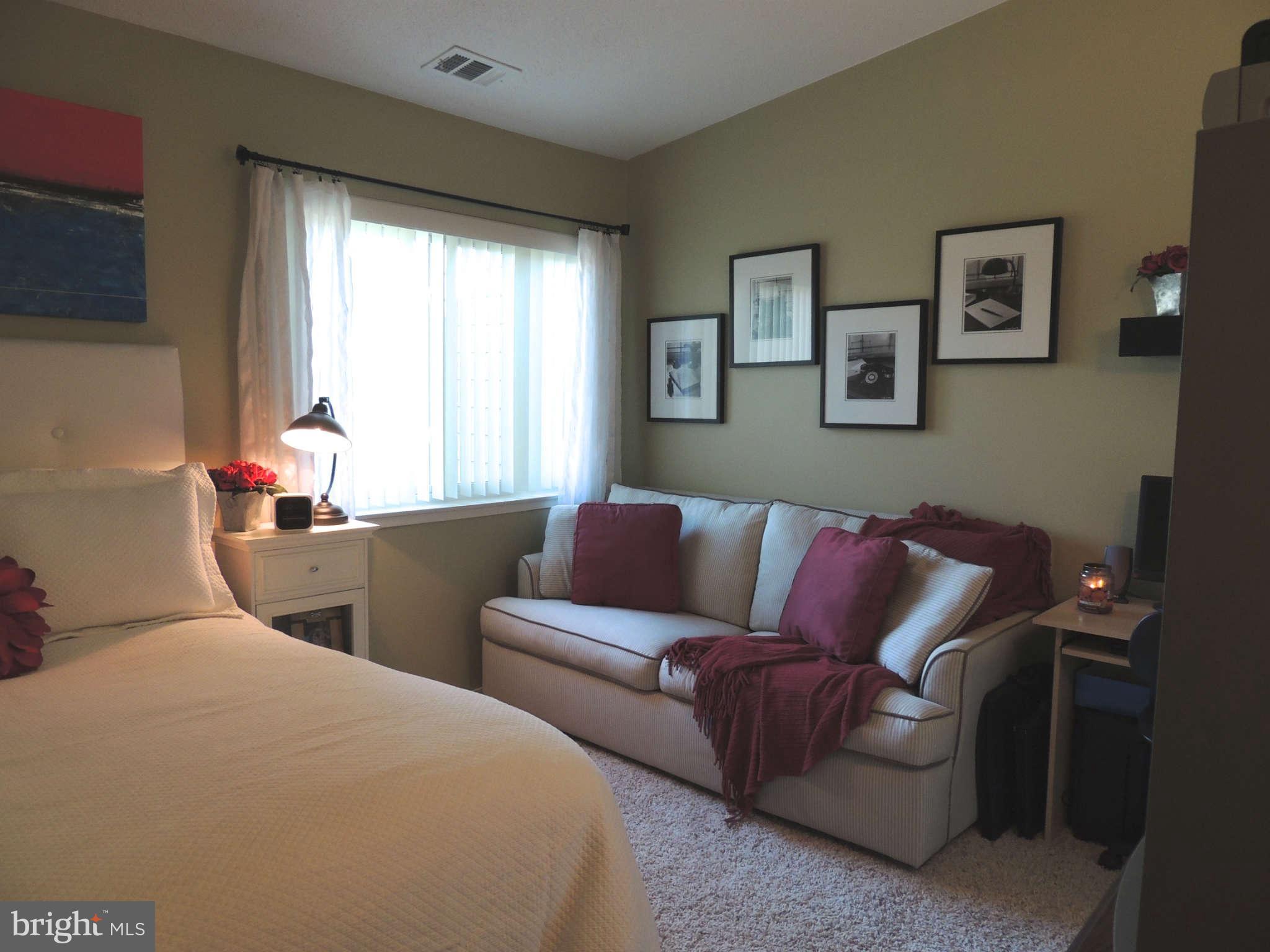 11033 Villaridge Court, Unit B Reston, VA 20191 - Photo 14 of 25 a living room with furniture and a window
