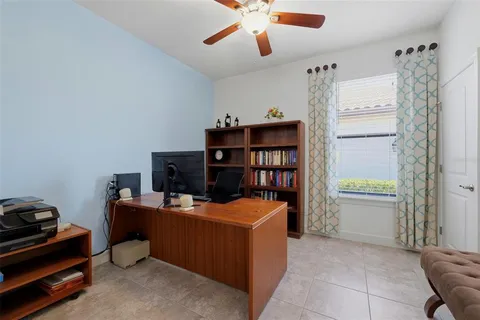 a room with furniture a rug and a window