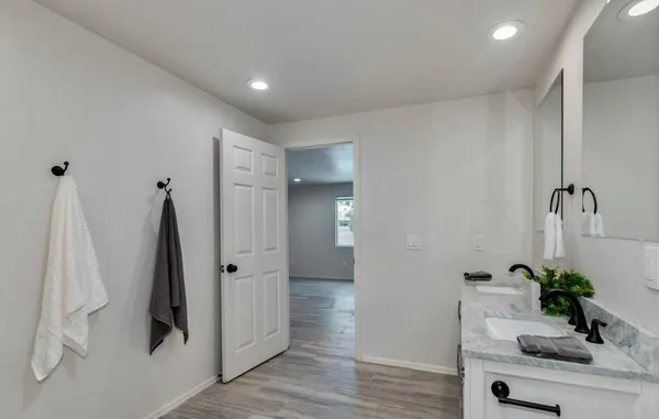 a bathroom with a sink and mirror