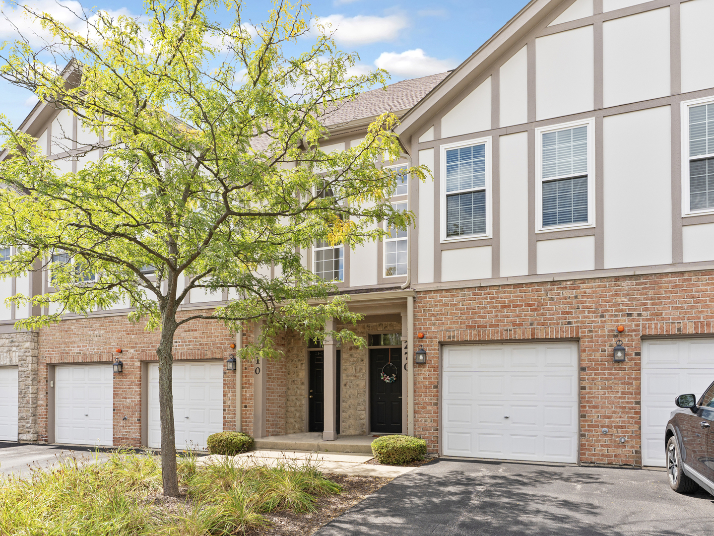 a view of a house with a tree