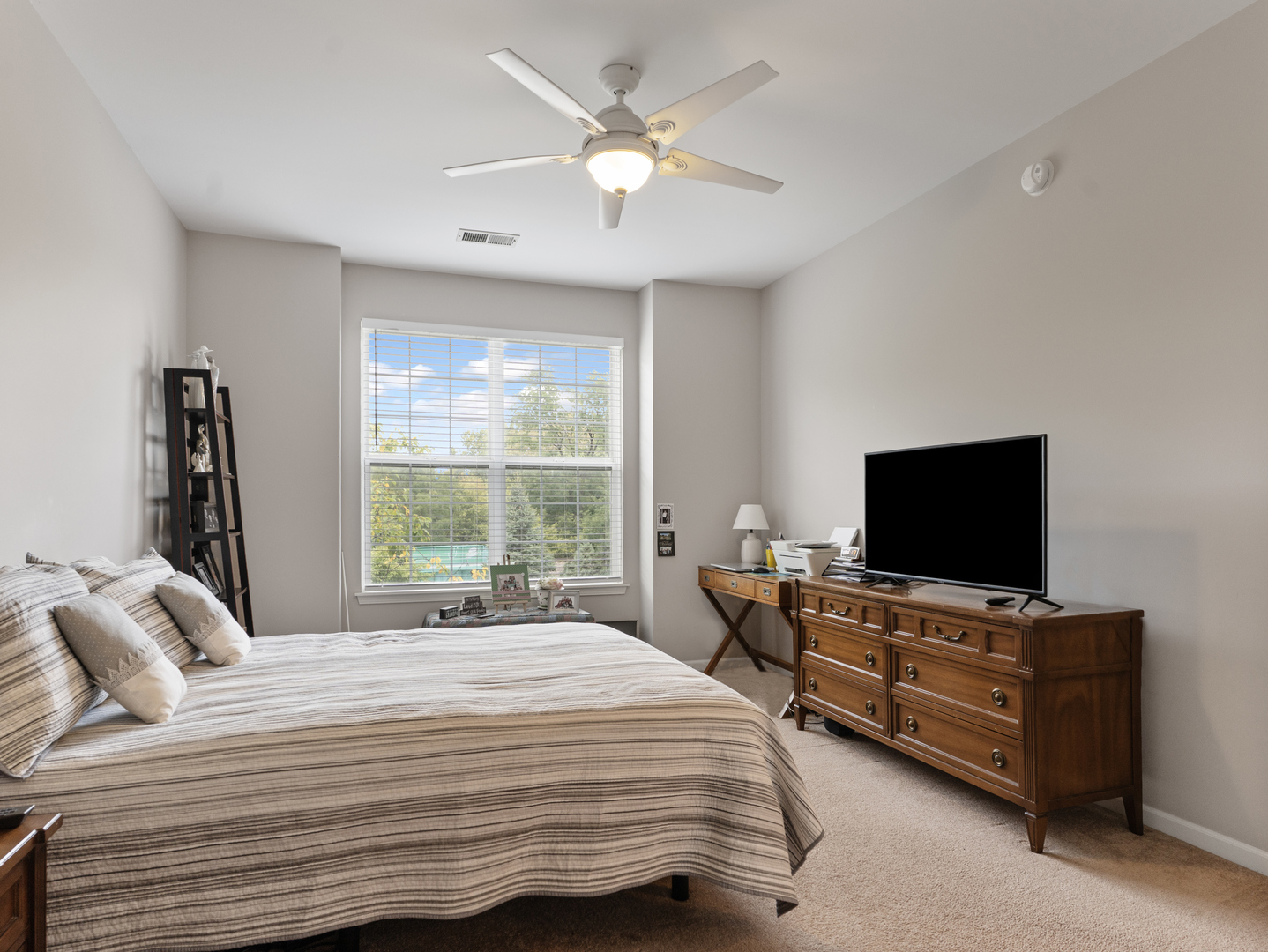880 June Terrace, Unit 270 Lake Zurich, IL 60047 - Photo 12 of 26 a bedroom with a bed and a flat screen tv