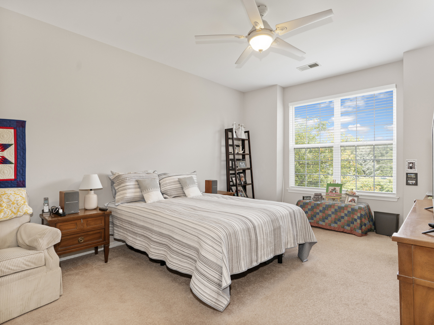 880 June Terrace, Unit 270 Lake Zurich, IL 60047 - Photo 13 of 26 a bedroom with a bed couch and window