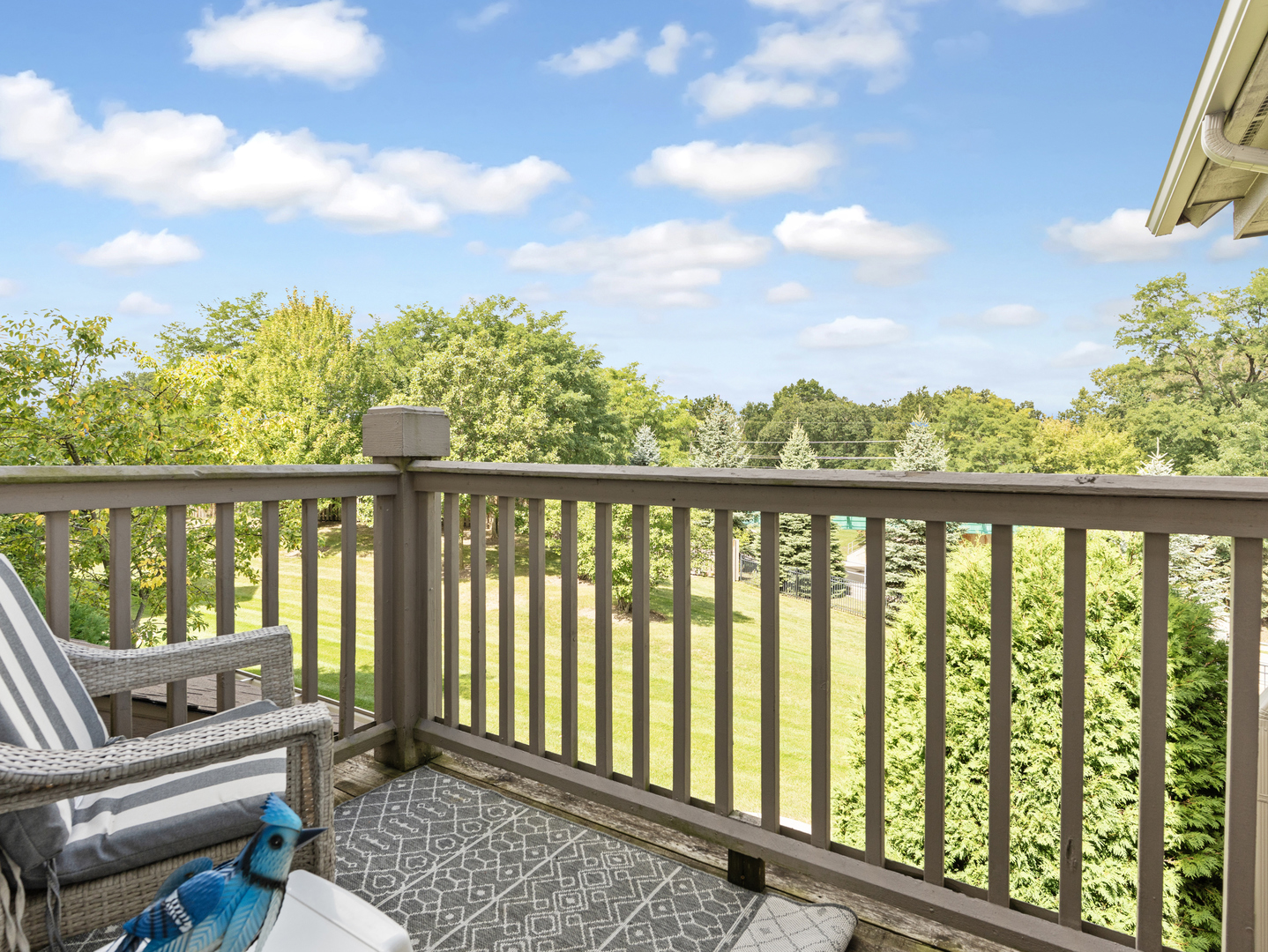 880 June Terrace, Unit 270 Lake Zurich, IL 60047 - Photo 20 of 26 a balcony with wooden floor and fence