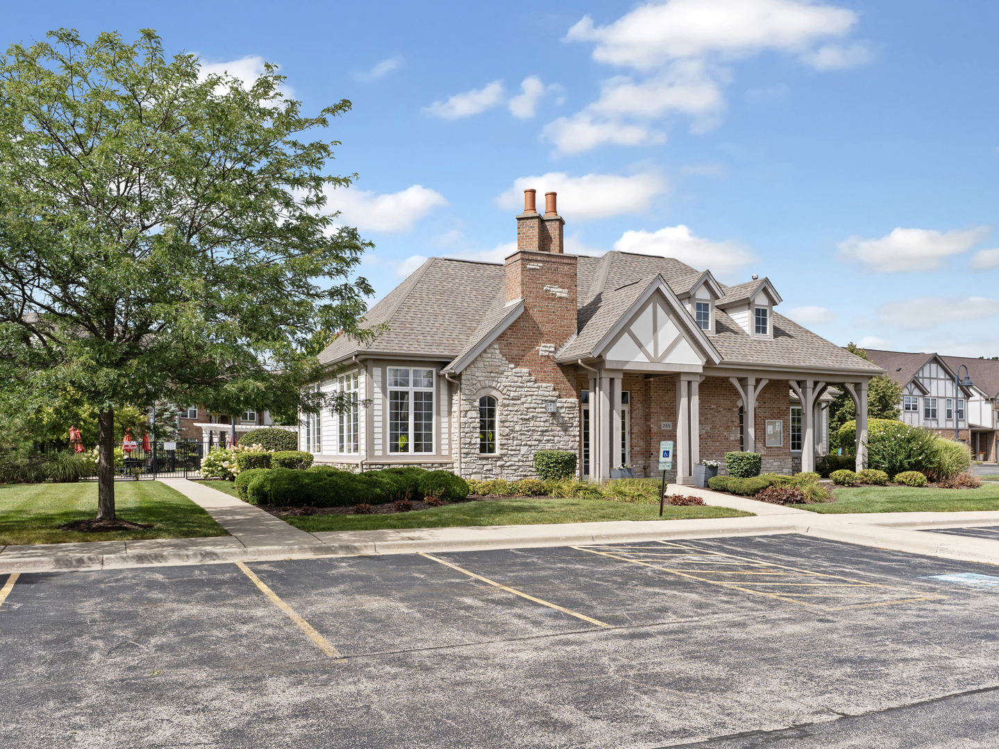 880 June Terrace, Unit 270 Lake Zurich, IL 60047 - Photo 24 of 26 a front view of a house with a yard