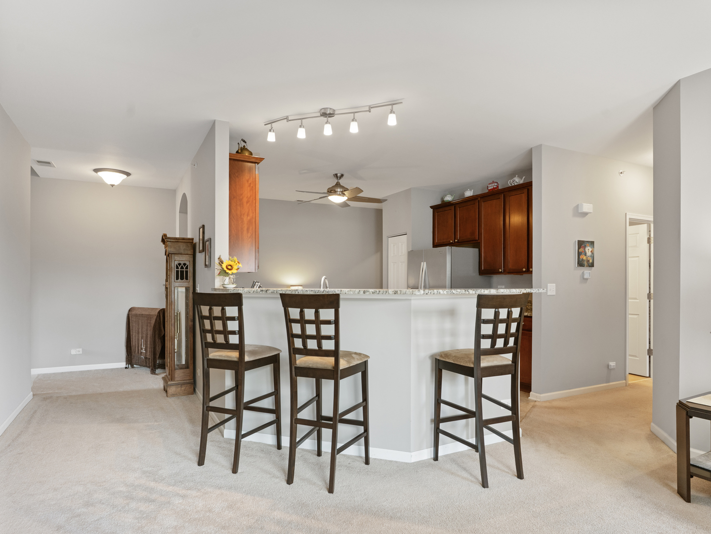 880 June Terrace, Unit 270 Lake Zurich, IL 60047 - Photo 8 of 26 a open kitchen with a table and chairs in it