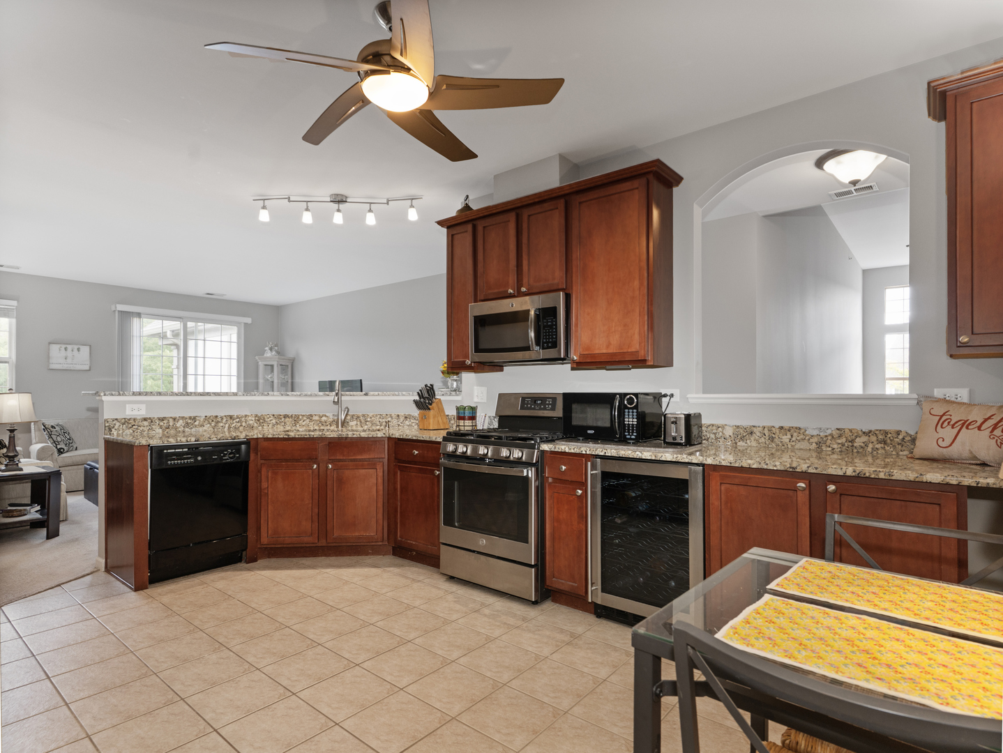 880 June Terrace, Unit 270 Lake Zurich, IL 60047 - Photo 9 of 26 a kitchen with stainless steel appliances granite countertop a stove sink and cabinets