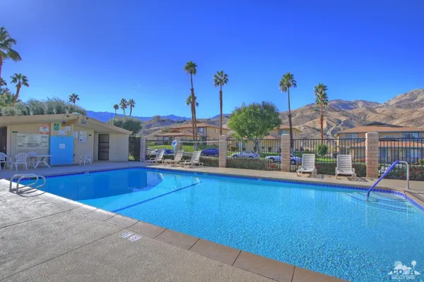 a view of a house with swimming pool