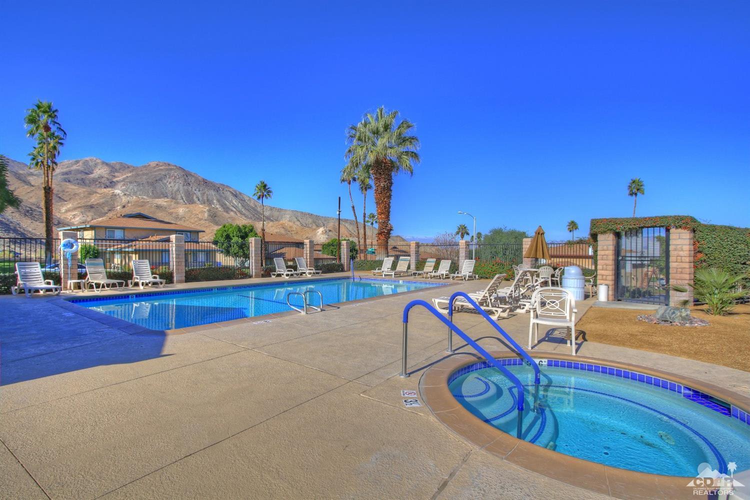 72664 Eagle Road, Unit 3 Palm Desert, CA 92260 - Photo 15 of 16 a view of a swimming pool with a lounge chair