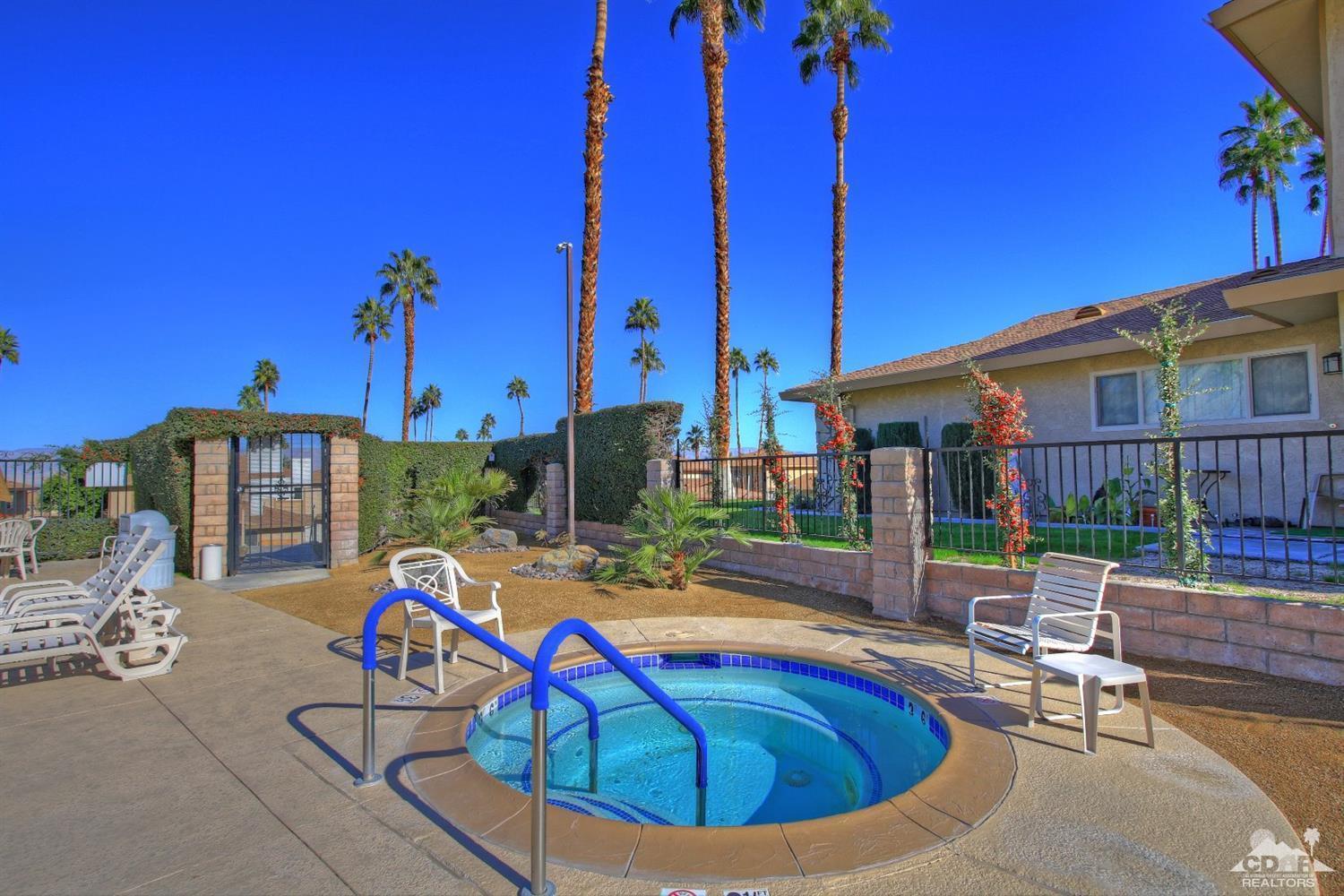 72664 Eagle Road, Unit 3 Palm Desert, CA 92260 - Photo 16 of 16 a view of a house with swimming pool and sitting area