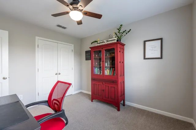 a view of a workspace with furniture