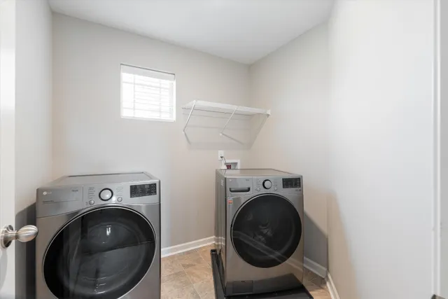 a view of a storage & utility room with washer and dryer
