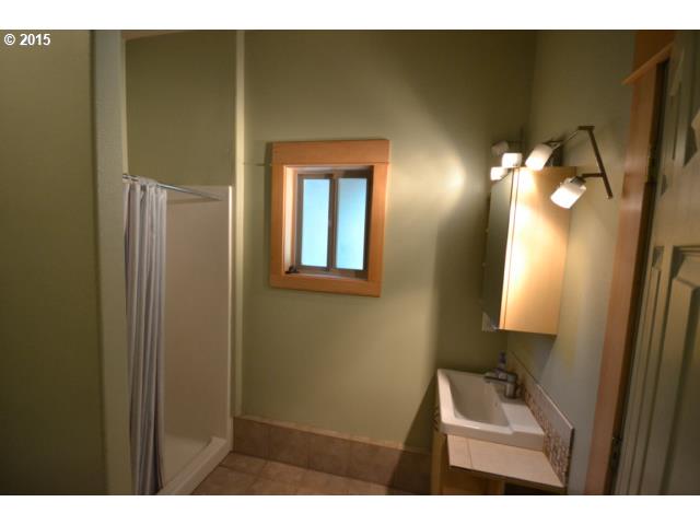 249 Northeast Frank Johns Road Stevenson, WA 98648 - Photo 12 of 13 a bathroom with a sink and a mirror