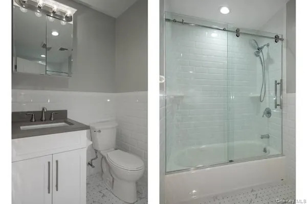 a bathroom with a granite countertop sink a toilet and shower