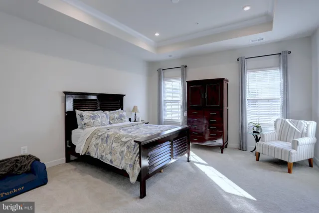 a bedroom with a bed and a couch