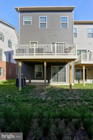 a front view of a brick building with a yard