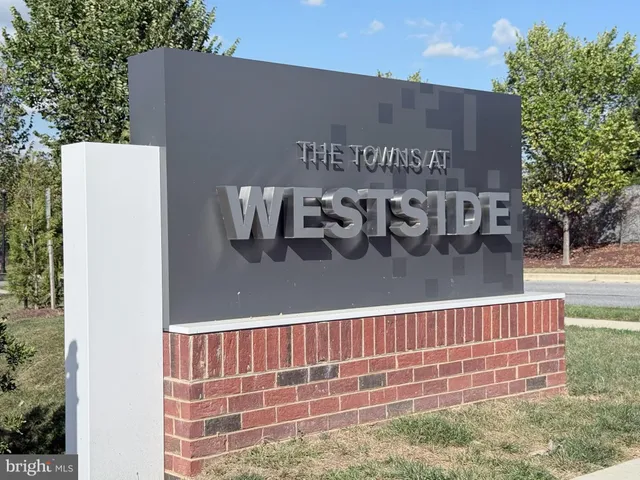 a view of a building with car parked