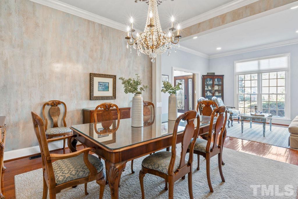 5844 Applegarth Lane Raleigh, NC 27614 - Photo 13 of 70 a dining room with furniture and chandelier