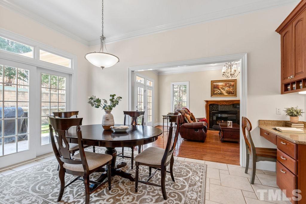 5844 Applegarth Lane Raleigh, NC 27614 - Photo 24 of 70 a dining room with furniture a livingroom and chandelier