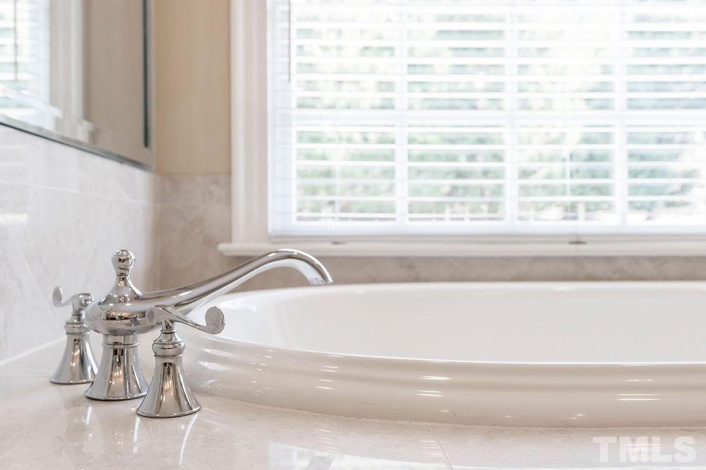 5844 Applegarth Lane Raleigh, NC 27614 - Photo 33 of 70 a bath tub sitting next to a window