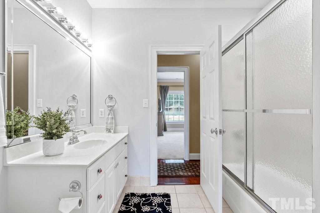 5844 Applegarth Lane Raleigh, NC 27614 - Photo 41 of 70 a bathroom with a sink and a mirror