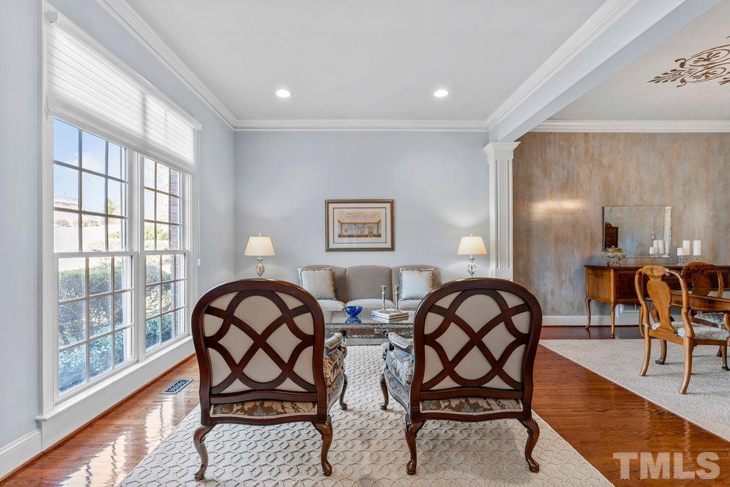 5844 Applegarth Lane Raleigh, NC 27614 - Photo 10 of 70 a view of a a dining room with furniture window and wooden floor