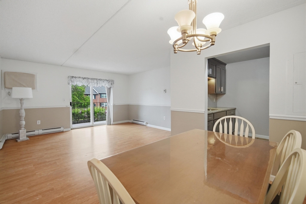 36 Maple Crest Circle, Unit F Holyoke, MA 01040 - Photo 3 of 16 a view of livingroom with chandelier