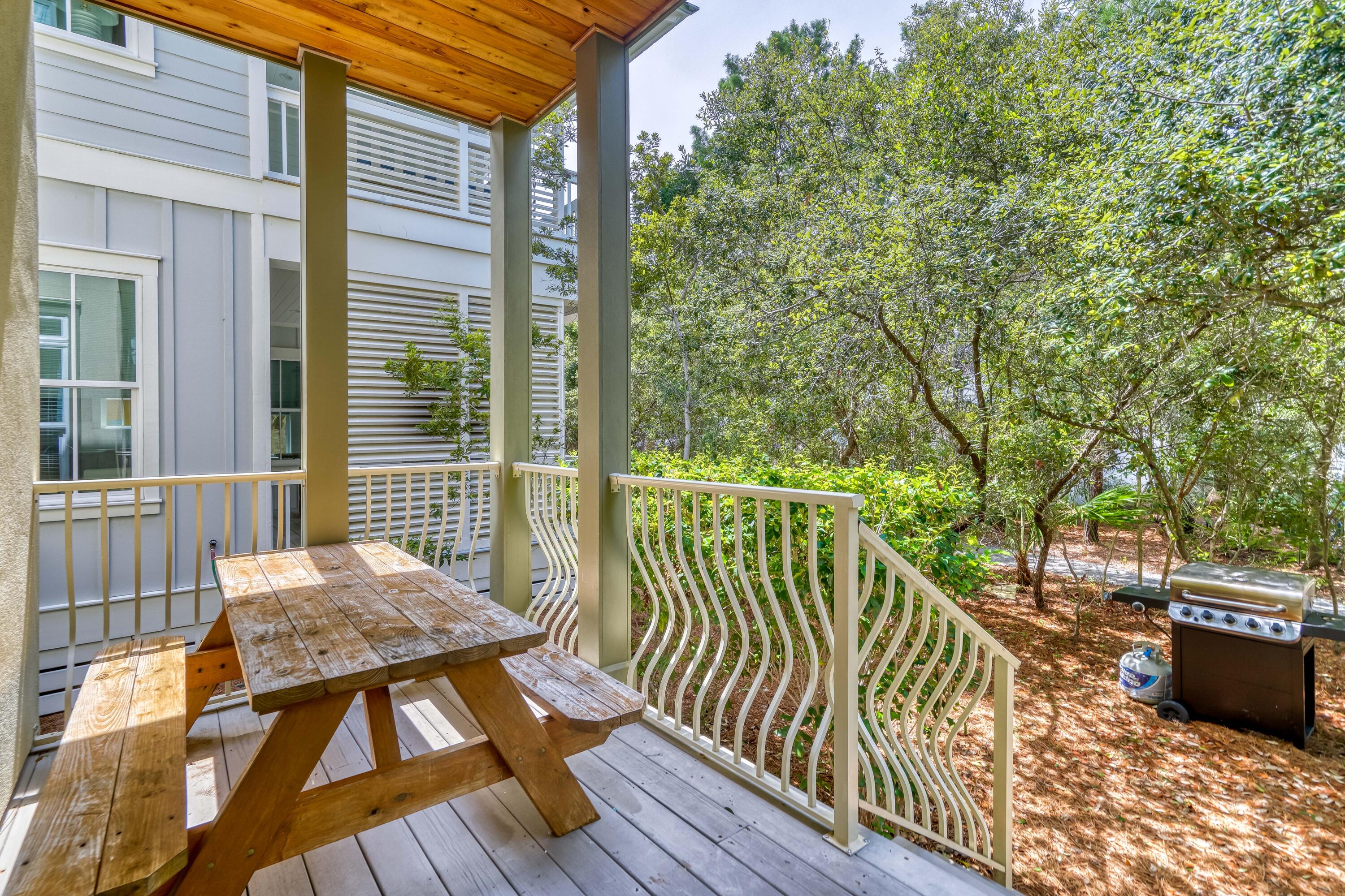 48 Cast Net Lane Inlet Beach, FL 32461 - Photo 58 of 61 a view of balcony with wooden floor and outdoor seating