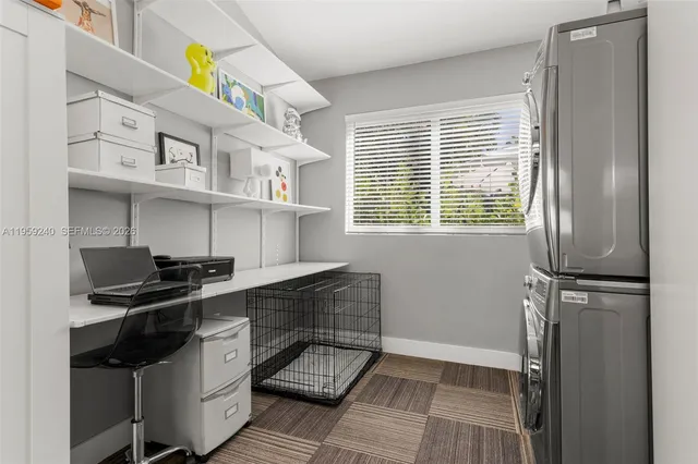 a kitchen with stainless steel appliances granite countertop a stove and a refrigerator