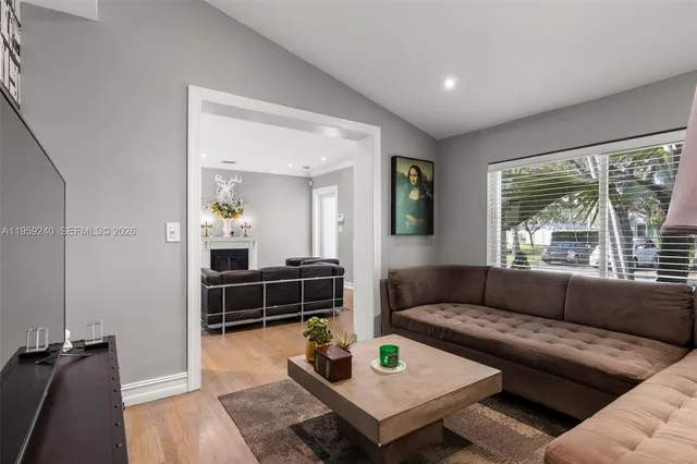 a living room with furniture and a large window