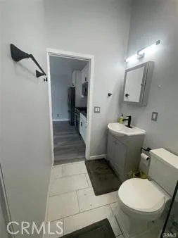 a bathroom with a toilet and a sink