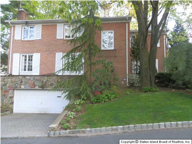 275 Douglas Road Staten Island, NY 10304 - Photo 1 of 11 front view of a house with a yard