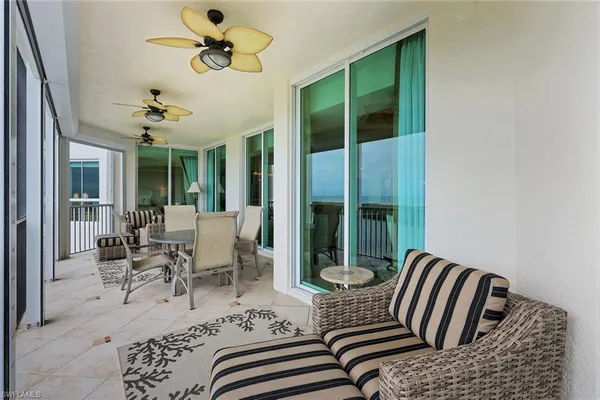 a view of a living room and balcony