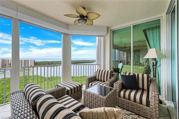 a view of a chairs and table in patio