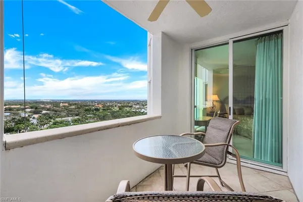 a utility room with cabinets washer and dryer