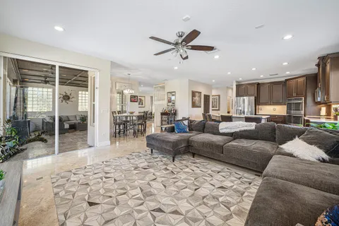 a bed room with a bed and a ceiling fan
