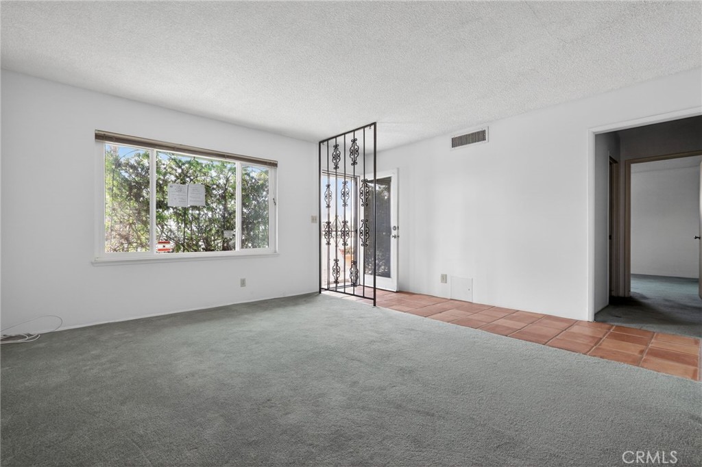 11675 Calvin Street Yucaipa, CA 92399 - Photo 11 of 30 an empty room with windows