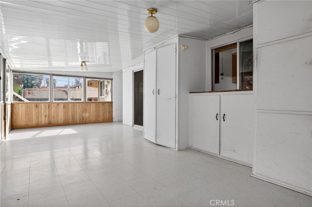 11675 Calvin Street Yucaipa, CA 92399 - Photo 13 of 30 a view of a big room with windows and cabinet