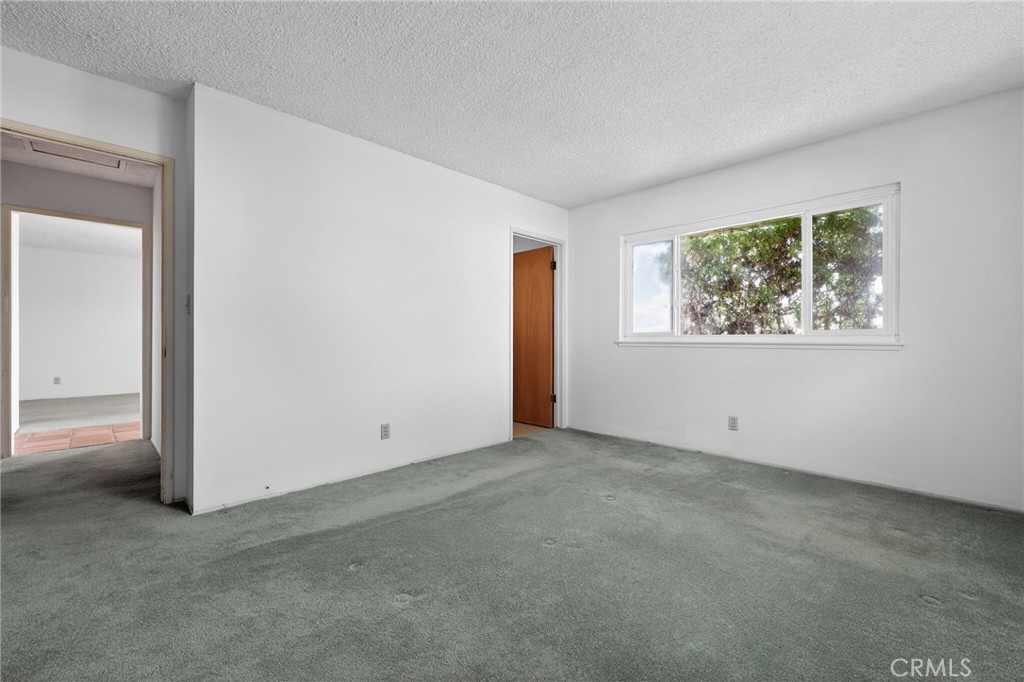 11675 Calvin Street Yucaipa, CA 92399 - Photo 15 of 30 an empty room with windows