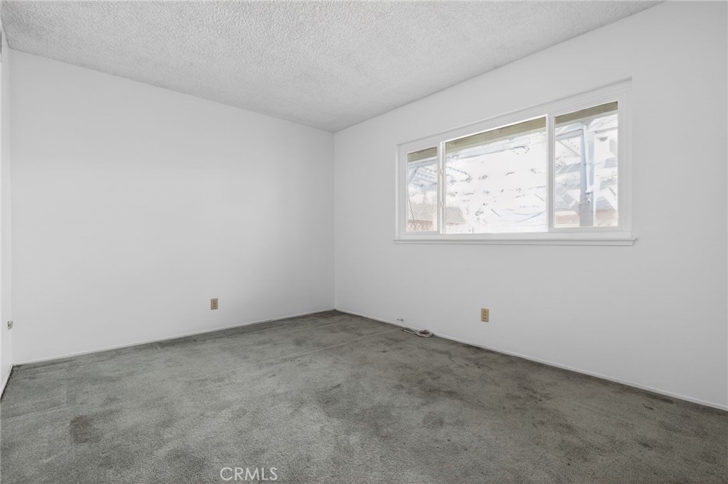 11675 Calvin Street Yucaipa, CA 92399 - Photo 17 of 30 an empty room with a window