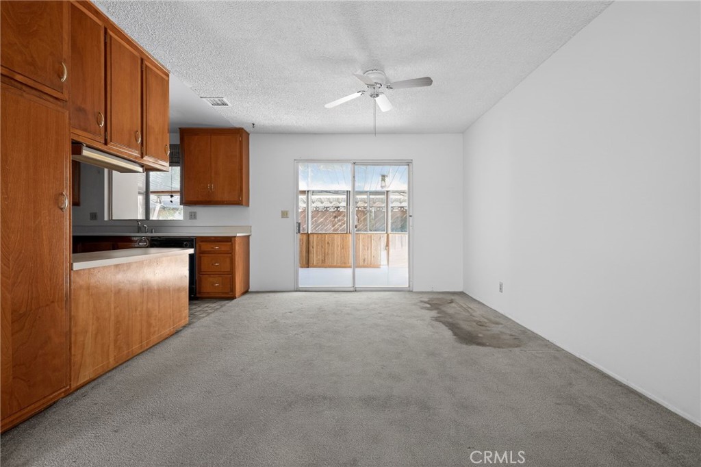11675 Calvin Street Yucaipa, CA 92399 - Photo 19 of 30 a view of a kitchen with a sink cabinets and a window