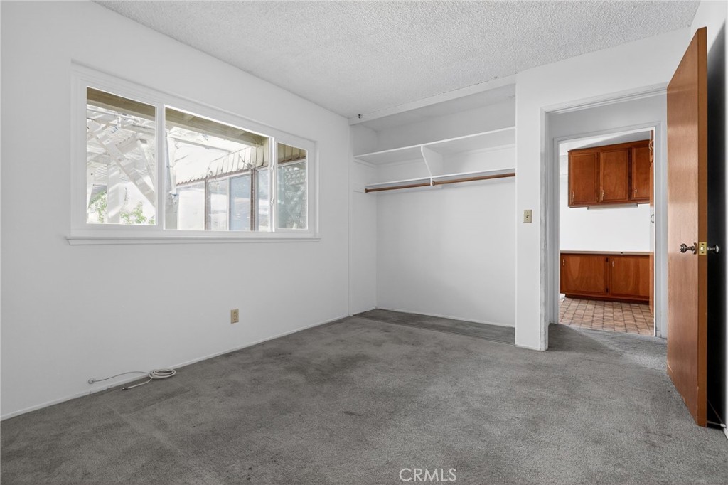 11675 Calvin Street Yucaipa, CA 92399 - Photo 25 of 30 an empty room with windows and closet