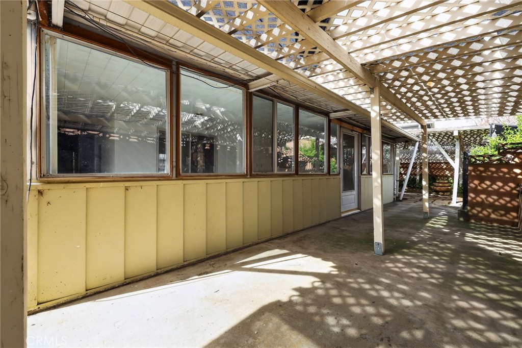11675 Calvin Street Yucaipa, CA 92399 - Photo 5 of 30 a view of a porch with a table and chairs