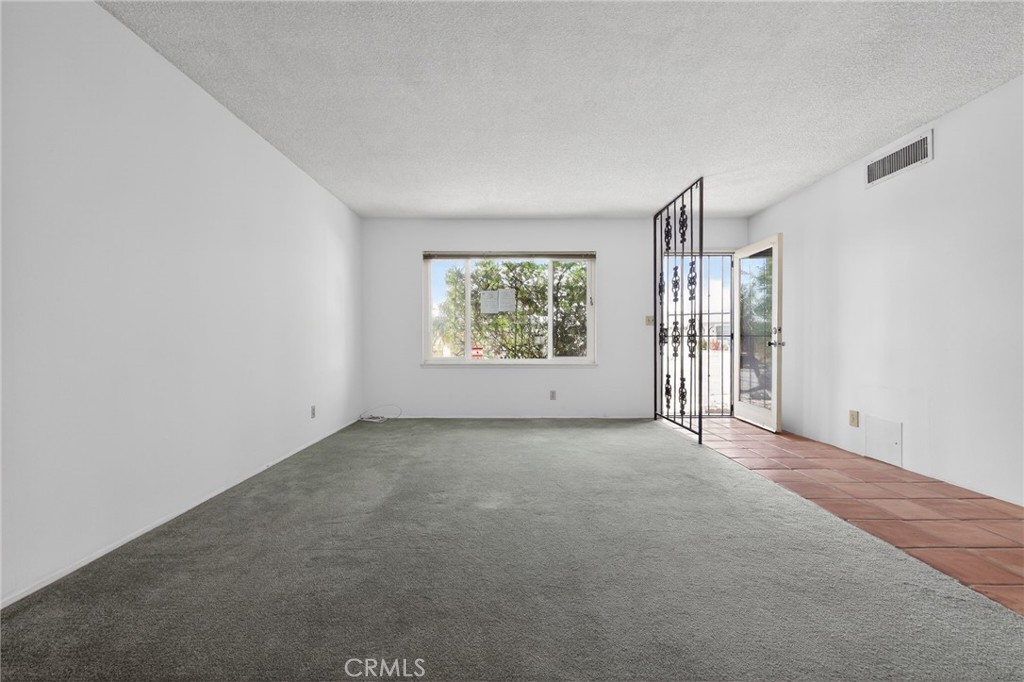 11675 Calvin Street Yucaipa, CA 92399 - Photo 9 of 30 an empty room with windows